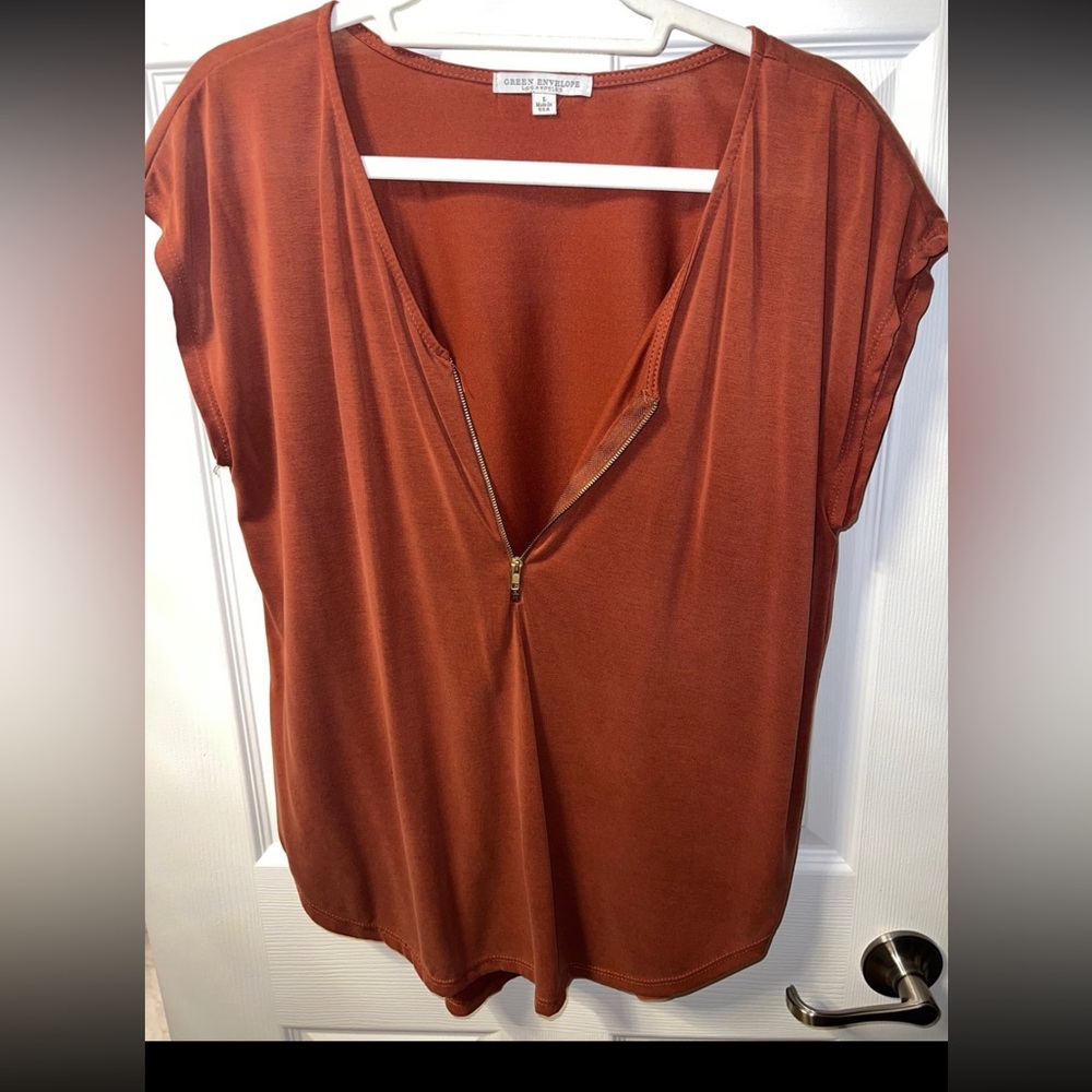 Shirt with half way front zipper
